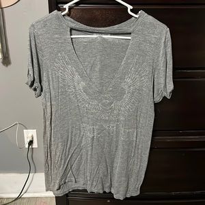 Charlotte Russe Grey V-neck top, faded “Free Bird”